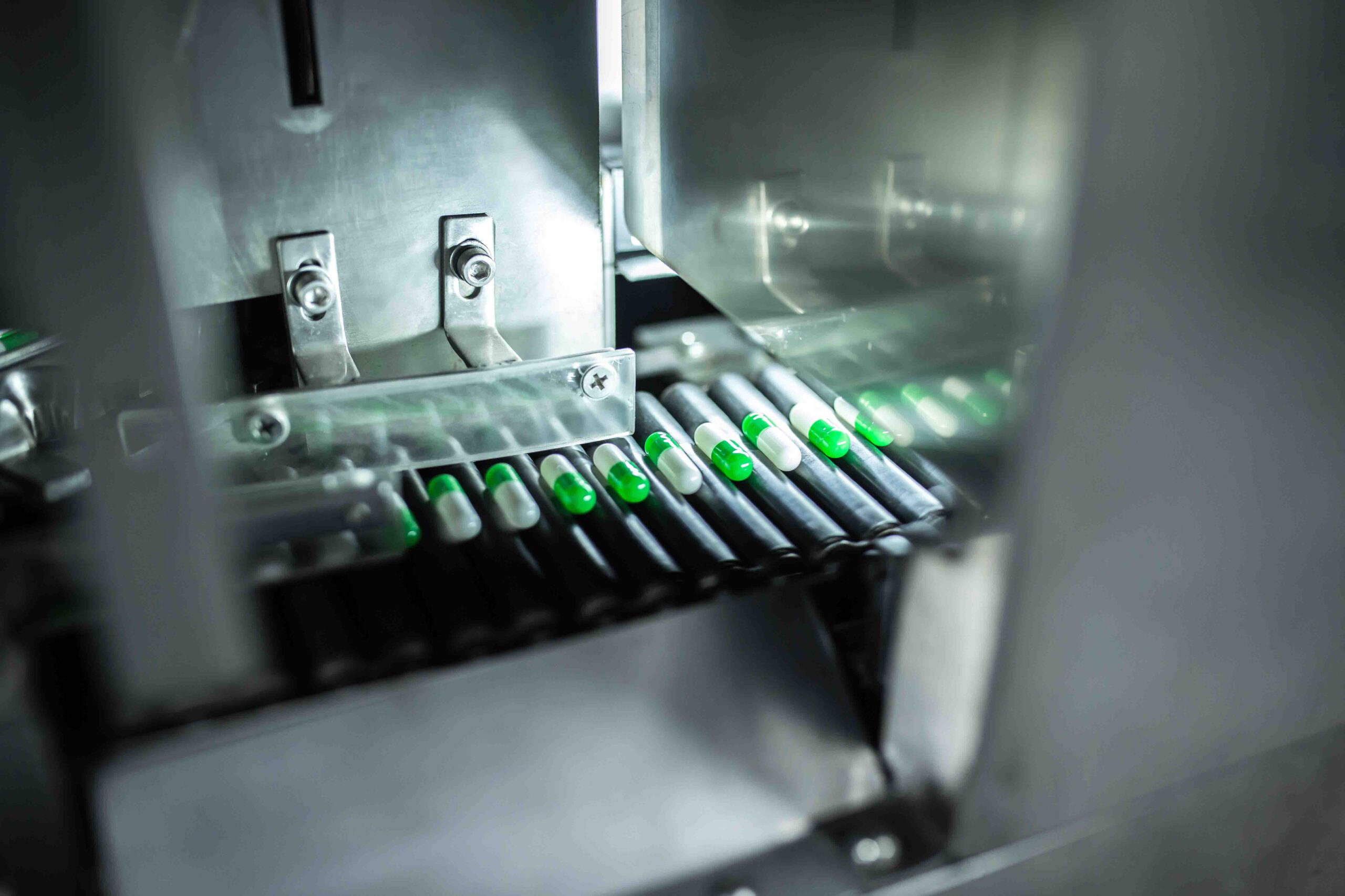 Empty HPMC capsules undergoing a friability test in a lab setting